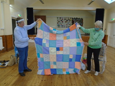 Gill started making the squares some years ago using some Aran wool she had left over from making a cardigan.  She used dk, Aran and chunky whatever she could find, when there wasn’t enough wool for a whole square  made half or quarter squares to make a whole.  Gill thinks it is about big enough now.