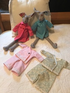 Rabbits with a full wardrobes made for Isla and Daisy by grandma Christine Boyd.