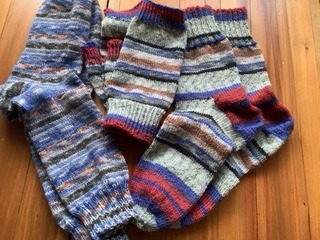 Socks and fingerless gloves made by Jenny Crisp for her son and his girlfriend