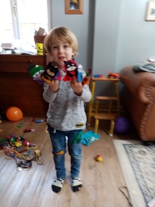 Evelyn’s grandson demonstrating hand puppets she made