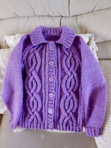 Child’s cardigan knitted by Jan Clark