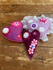 A variety of pin cushions made by Gill 