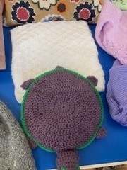 Knitted baby blanket and crochet play turtle both made by Heather
