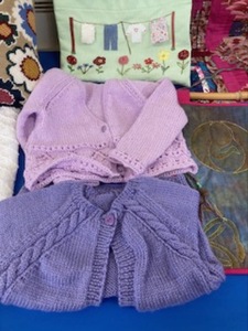 Sweaters knitted by Kate P for her grand daughters 
