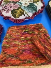 Becky knitted this beautiful bag and purse and then put it in a hot washed to felt.