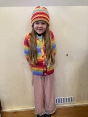 Cardigan and hat made for and modelled by her great granddaughter by Pat