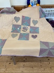 Julie H has made the appliqué blocks from the summer workshop into a lovely quilt
