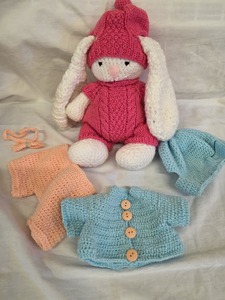 Rabbit and outfits for a grandchild by Jackie
