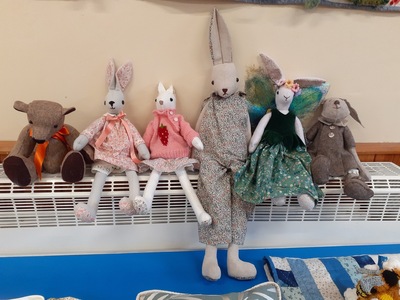 Sue has crafted a wonderful family of bunnies with a memory bear. They look so contented together.