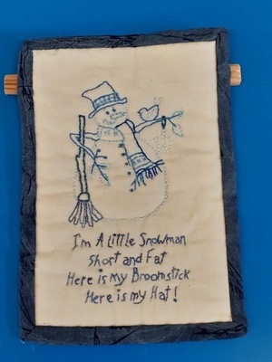 Kate has produced an delightful, embroidered snowman. It will look good as a wall hanging.