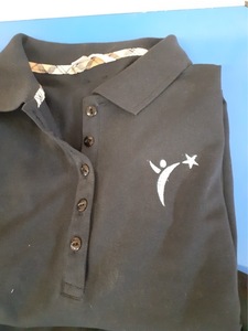 Jean was asked by Evelyn to reproduce a logo on a shirt by making use of her technological skills. The likeness to the original is impressive