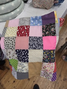 Jenny P - 4 inch squares experiment with quilting worked to make a play mat for her grandson.
